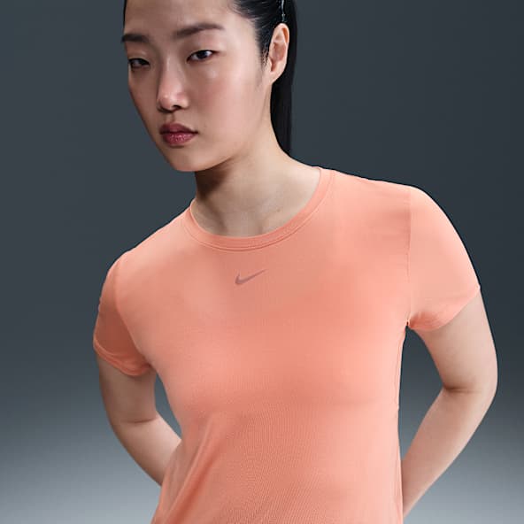 NIKE公式】 オレンジ トップス & Tシャツ【ナイキ公式通販】